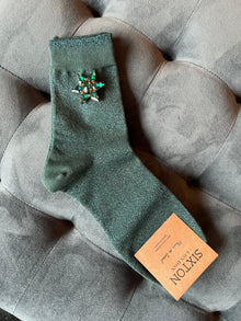  A pair of socks and a sparkly pin