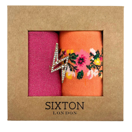Socks in a box with a sparkly pin