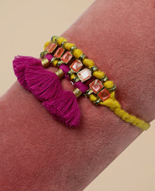  Tasselled bracelet in mustard and fuchsia - Powder Design